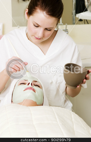 To use this stock image in your creative project, please select the size you need over to the right and click the "Add to Cart" button.
Your downloaded image will come with the Cutcaster watermark removed so don’t worry about the watermark you see on this page. Facial Mask stock photo, A detail image of a green apple mask being applied at a beauty spa. by Tyler Olson