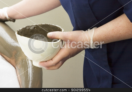 To use this stock image in your creative project, please select the size you need over to the right and click the "Add to Cart" button.
Your downloaded image will come with the Cutcaster watermark removed so don’t worry about the watermark you see on this page. Full Body Wrap Detail stock photo, A detail image of a sea mud full body wrap at a luxury spa being applied to the arm. by Tyler Olson