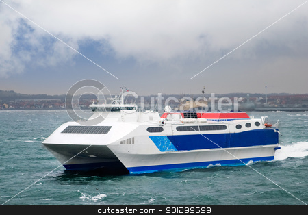 To use this stock image in your creative project, please select the size you need over to the right and click the "Add to Cart" button.
Your downloaded image will come with the Cutcaster watermark removed so don’t worry about the watermark you see on this page. Speed Ferry stock photo, A fast catamaran ferry by Tyler Olson