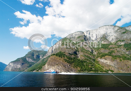 To use this stock image in your creative project, please select the size you need over to the right and click the "Add to Cart" button.
Your downloaded image will come with the Cutcaster watermark removed so don’t worry about the watermark you see on this page. Norway Fjord Scenic with Ferry stock photo, Fjord Scenic from the pass between Aurlandsfjord and naeroyfjord (nryfjord), in Sognefjord, Norway by Tyler Olson