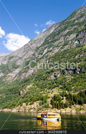 To use this stock image in your creative project, please select the size you need over to the right and click the "Add to Cart" button.
Your downloaded image will come with the Cutcaster watermark removed so don’t worry about the watermark you see on this page. Safety Boat in Fjord stock photo, A yellow life raft boat on the aurlandsfjord, Norway by Tyler Olson