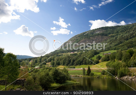 To use this stock image in your creative project, please select the size you need over to the right and click the "Add to Cart" button.
Your downloaded image will come with the Cutcaster watermark removed so don’t worry about the watermark you see on this page. Norwegian Landscape with Parachute stock photo, A Norwegian mountain landscape with a parachute in the sky by Tyler Olson