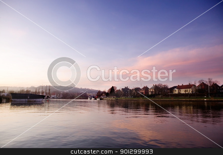 To use this stock image in your creative project, please select the size you need over to the right and click the "Add to Cart" button.
Your downloaded image will come with the Cutcaster watermark removed so don’t worry about the watermark you see on this page. Harbor at Sunset stock photo, A boat harbor in the late fall painted in the evening light of sunset by Tyler Olson