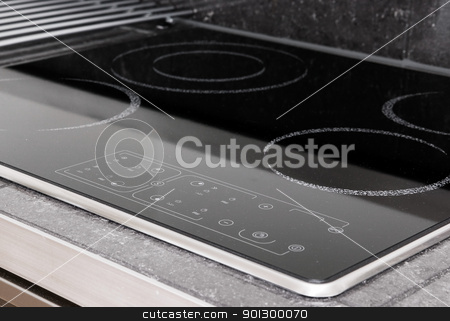 To use this stock image in your creative project, please select the size you need over to the right and click the "Add to Cart" button.
Your downloaded image will come with the Cutcaster watermark removed so don’t worry about the watermark you see on this page. Induction Stove Detail stock photo, A modern induction stove detail by Tyler Olson