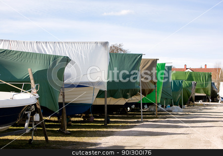 To use this stock image in your creative project, please select the size you need over to the right and click the "Add to Cart" button.
Your downloaded image will come with the Cutcaster watermark removed so don’t worry about the watermark you see on this page. Winter Boat Storage stock photo, A row of boats in storage for the winter in Norway. by Tyler Olson