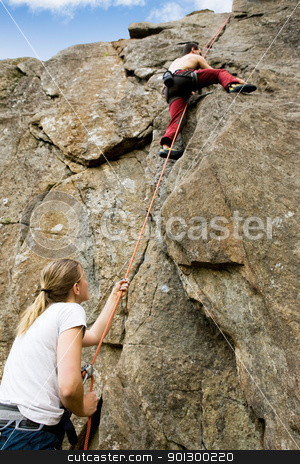 To use this stock image in your creative project, please select the size you need over to the right and click the "Add to Cart" button.
Your downloaded image will come with the Cutcaster watermark removed so don’t worry about the watermark you see on this page. Two climbers stock photo, A female belaying a male on a steep rock face. Shallow depth of field with the focus on the climbing which is belaying (the on at the bottom) by Tyler Olson
