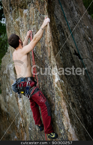 To use this stock image in your creative project, please select the size you need over to the right and click the "Add to Cart" button.
Your downloaded image will come with the Cutcaster watermark removed so don’t worry about the watermark you see on this page. Male Rock Climber stock photo, A male climber, viewed from above, climbs a very high and steep crag. The image is taken as the climber clips into the bolt. by Tyler Olson