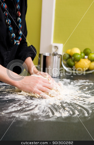 To use this stock image in your creative project, please select the size you need over to the right and click the "Add to Cart" button.
Your downloaded image will come with the Cutcaster watermark removed so don’t worry about the watermark you see on this page. Kneading Dough with Hands stock photo, A young woman makes bread on the counter at home in the kitchen. by Tyler Olson