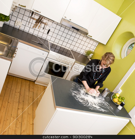 To use this stock image in your creative project, please select the size you need over to the right and click the "Add to Cart" button.
Your downloaded image will come with the Cutcaster watermark removed so don’t worry about the watermark you see on this page. Woman Making Bread at Home stock photo, A young woman makes bread on the counter at home in the kitchen. by Tyler Olson