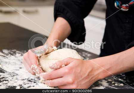 To use this stock image in your creative project, please select the size you need over to the right and click the "Add to Cart" button.
Your downloaded image will come with the Cutcaster watermark removed so don’t worry about the watermark you see on this page. Kneading Dough with Hands stock photo, A young woman makes bread on the counter at home in the kitchen. by Tyler Olson