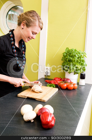 To use this stock image in your creative project, please select the size you need over to the right and click the "Add to Cart" button.
Your downloaded image will come with the Cutcaster watermark removed so don’t worry about the watermark you see on this page. Slicing Vegetables stock photo, A woman cutting vegetables at home on the counter by Tyler Olson