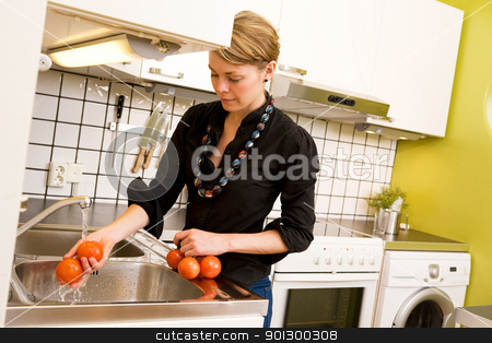 To use this stock image in your creative project, please select the size you need over to the right and click the "Add to Cart" button.
Your downloaded image will come with the Cutcaster watermark removed so don’t worry about the watermark you see on this page. Female Washing Tomatoes stock photo, A woman is washing tomatoes in the sink at home in the kitchen. by Tyler Olson