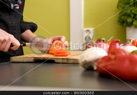 To use this stock image in your creative project, please select the size you need over to the right and click the "Add to Cart" button.
Your downloaded image will come with the Cutcaster watermark removed so don’t worry about the watermark you see on this page. Cutting Tomatoes Detail stock photo, A detail image of a woman slicing tomatoes on a cutting board at home. - shallow depth of field with the focus on the tomato and knife by Tyler Olson
