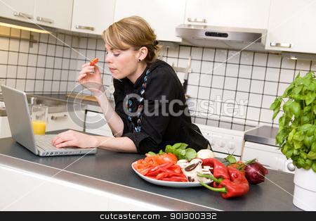 To use this stock image in your creative project, please select the size you need over to the right and click the "Add to Cart" button.
Your downloaded image will come with the Cutcaster watermark removed so don’t worry about the watermark you see on this page. Surfing in the Kitchen stock photo, A young business woman surfs the internet while eating a healthy lunch of vegetables. by Tyler Olson