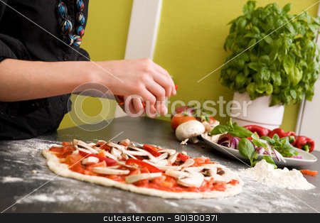 To use this stock image in your creative project, please select the size you need over to the right and click the "Add to Cart" button.
Your downloaded image will come with the Cutcaster watermark removed so don’t worry about the watermark you see on this page. Homemade Italian Style Pizza stock photo, A young female making an italian style pizza at home in her apartment kitchen. - Shallow depth of field is used, with focus on the pizza and hands. by Tyler Olson