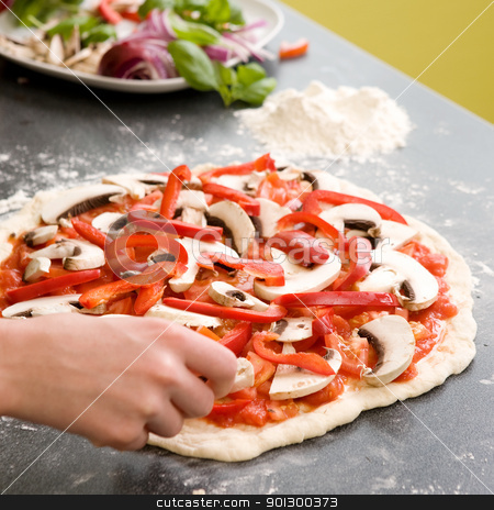 To use this stock image in your creative project, please select the size you need over to the right and click the "Add to Cart" button.
Your downloaded image will come with the Cutcaster watermark removed so don’t worry about the watermark you see on this page. Homemade Italian Style Pizza stock photo, A young female making an italian style pizza at home in her apartment kitchen. by Tyler Olson