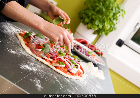 To use this stock image in your creative project, please select the size you need over to the right and click the "Add to Cart" button.
Your downloaded image will come with the Cutcaster watermark removed so don’t worry about the watermark you see on this page. Pizza Making Detail stock photo, Italian style vegetarian pizza on the counter waiting to be baked. by Tyler Olson