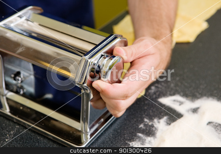To use this stock image in your creative project, please select the size you need over to the right and click the "Add to Cart" button.
Your downloaded image will come with the Cutcaster watermark removed so don’t worry about the watermark you see on this page. Pasta Machine stock photo, Adjusting the roller on a manual pasta machine by Tyler Olson