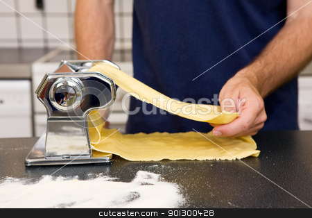 To use this stock image in your creative project, please select the size you need over to the right and click the "Add to Cart" button.
Your downloaded image will come with the Cutcaster watermark removed so don’t worry about the watermark you see on this page. Making Pasta Detail stock photo, A Male making pasta on the counter in the kitchen. by Tyler Olson