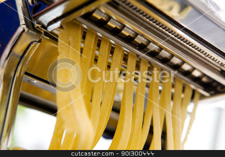 To use this stock image in your creative project, please select the size you need over to the right and click the "Add to Cart" button.
Your downloaded image will come with the Cutcaster watermark removed so don’t worry about the watermark you see on this page. Homemade Pasta Fettuccine Detail stock photo, Fettuccine coming out of a manual pastamachine - shallow depth of field with focus on the pasta by Tyler Olson