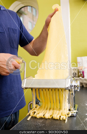 To use this stock image in your creative project, please select the size you need over to the right and click the "Add to Cart" button.
Your downloaded image will come with the Cutcaster watermark removed so don’t worry about the watermark you see on this page. Homemade Fettuccine stock photo, Fettuccine coming out of a manual pastamachine - shallow depth of field with focus on the pasta by Tyler Olson