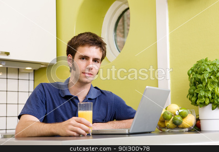 To use this stock image in your creative project, please select the size you need over to the right and click the "Add to Cart" button.
Your downloaded image will come with the Cutcaster watermark removed so don’t worry about the watermark you see on this page. Kitchen Computer stock photo, A young male using a laptop computer in the kicthen and smiling at the camera. by Tyler Olson