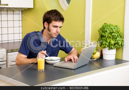 To use this stock image in your creative project, please select the size you need over to the right and click the "Add to Cart" button.
Your downloaded image will come with the Cutcaster watermark removed so don’t worry about the watermark you see on this page. Kitchen Computer Work stock photo, A young male works on the computer in the kicthen while eating breakfast by Tyler Olson