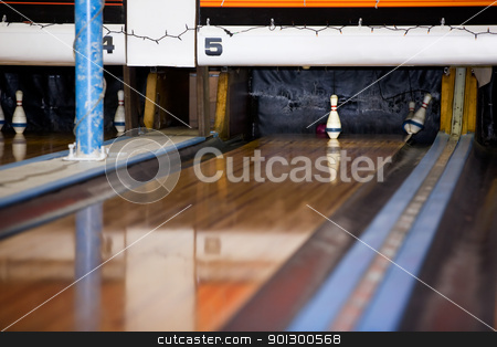 To use this stock image in your creative project, please select the size you need over to the right and click the "Add to Cart" button.
Your downloaded image will come with the Cutcaster watermark removed so don’t worry about the watermark you see on this page. Last Pin Standing stock photo, The single middle pin remains standing in a retro five pin bowling alley. by Tyler Olson