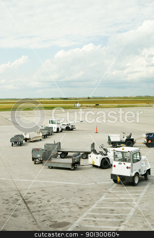 To use this stock image in your creative project, please select the size you need over to the right and click the "Add to Cart" button.
Your downloaded image will come with the Cutcaster watermark removed so don’t worry about the watermark you see on this page. Baggage Cars stock photo, Baggage cars at an airport terminal. by Tyler Olson