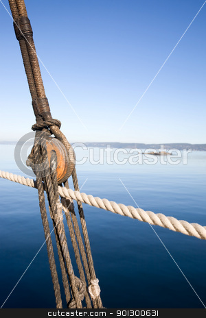To use this stock image in your creative project, please select the size you need over to the right and click the "Add to Cart" button.
Your downloaded image will come with the Cutcaster watermark removed so don’t worry about the watermark you see on this page. Boat Pulley Abstract stock photo, A boat pulley and rope system against a ocean landscape. by Tyler Olson