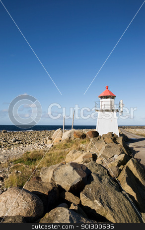 To use this stock image in your creative project, please select the size you need over to the right and click the "Add to Cart" button.
Your downloaded image will come with the Cutcaster watermark removed so don’t worry about the watermark you see on this page. Lighthouse stock photo, A small lighthouse on a rocky point by Tyler Olson