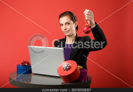 To use this stock image in your creative project, please select the size you need over to the right and click the "Add to Cart" button.
Your downloaded image will come with the Cutcaster watermark removed so don’t worry about the watermark you see on this page. Christmas Online stock photo, A young female shopping for christmas presents online. by Tyler Olson