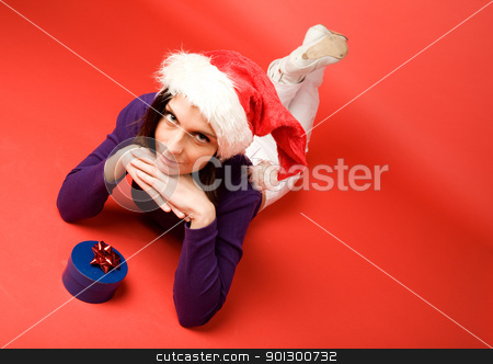 To use this stock image in your creative project, please select the size you need over to the right and click the "Add to Cart" button.
Your downloaded image will come with the Cutcaster watermark removed so don’t worry about the watermark you see on this page. Small Gift stock photo, A young woman with a present isolated on red by Tyler Olson