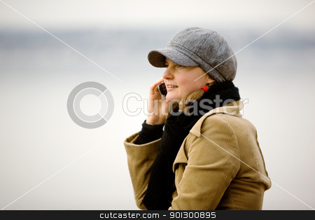 To use this stock image in your creative project, please select the size you need over to the right and click the "Add to Cart" button.
Your downloaded image will come with the Cutcaster watermark removed so don’t worry about the watermark you see on this page. Winter Cell Phone stock photo, A young woman talking on a cell phone in winter. by Tyler Olson