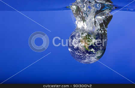 To use this stock image in your creative project, please select the size you need over to the right and click the "Add to Cart" button.
Your downloaded image will come with the Cutcaster watermark removed so don’t worry about the watermark you see on this page. World Sinking in Water stock photo, A globe sinking in water with bubbles by Tyler Olson
