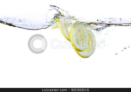 To use this stock image in your creative project, please select the size you need over to the right and click the "Add to Cart" button.
Your downloaded image will come with the Cutcaster watermark removed so don’t worry about the watermark you see on this page. Lemon Slice and Water stock photo, A group of lemon slices dropped in water with bubbles by Tyler Olson
