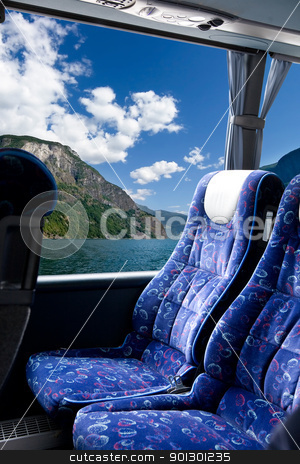 To use this stock image in your creative project, please select the size you need over to the right and click the "Add to Cart" button.
Your downloaded image will come with the Cutcaster watermark removed so don’t worry about the watermark you see on this page. Norwegian Fjord Bus Tour stock photo, A fjord view from a bus by Tyler Olson