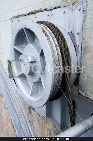 To use this stock image in your creative project, please select the size you need over to the right and click the "Add to Cart" button.
Your downloaded image will come with the Cutcaster watermark removed so don’t worry about the watermark you see on this page. Industrial Pulley stock photo, Large industrial pulley system or winch by Tyler Olson