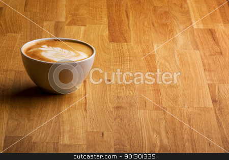 To use this stock image in your creative project, please select the size you need over to the right and click the "Add to Cart" button.
Your downloaded image will come with the Cutcaster watermark removed so don’t worry about the watermark you see on this page. Cappuccino stock photo, A warm specialty coffe on a wood table by Tyler Olson