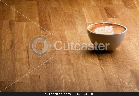 To use this stock image in your creative project, please select the size you need over to the right and click the "Add to Cart" button.
Your downloaded image will come with the Cutcaster watermark removed so don’t worry about the watermark you see on this page. Coffee stock photo, A warm specialty coffe on a wood table by Tyler Olson