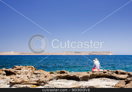 To use this stock image in your creative project, please select the size you need over to the right and click the "Add to Cart" button.
Your downloaded image will come with the Cutcaster watermark removed so don’t worry about the watermark you see on this page. Malta Fisherman stock photo, A maltese fisherman fishing in the sea by Tyler Olson