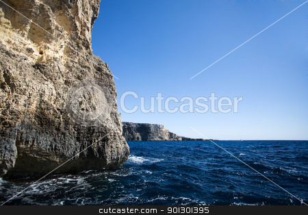 To use this stock image in your creative project, please select the size you need over to the right and click the "Add to Cart" button.
Your downloaded image will come with the Cutcaster watermark removed so don’t worry about the watermark you see on this page. Ocean Cliff Cave stock photo, A cave in the ocean with a ciff opening by Tyler Olson