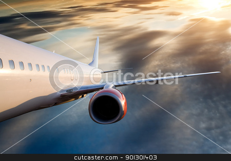 To use this stock image in your creative project, please select the size you need over to the right and click the "Add to Cart" button.
Your downloaded image will come with the Cutcaster watermark removed so don’t worry about the watermark you see on this page. Airplane in Sky stock photo, An airplane flying over a dramatic sky by Tyler Olson
