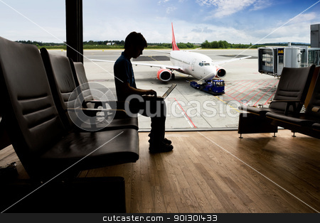 To use this stock image in your creative project, please select the size you need over to the right and click the "Add to Cart" button.
Your downloaded image will come with the Cutcaster watermark removed so don’t worry about the watermark you see on this page. Airport Terminal Computer stock photo, A young man using a laptop in an airport terminal by Tyler Olson
