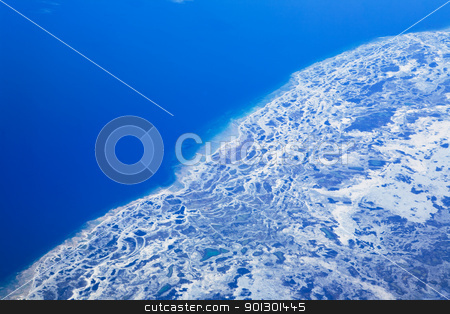 To use this stock image in your creative project, please select the size you need over to the right and click the "Add to Cart" button.
Your downloaded image will come with the Cutcaster watermark removed so don’t worry about the watermark you see on this page. Glacier Melt stock photo, An aerial view of a melting glacier in the ocean. by Tyler Olson