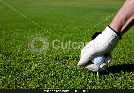To use this stock image in your creative project, please select the size you need over to the right and click the "Add to Cart" button.
Your downloaded image will come with the Cutcaster watermark removed so don’t worry about the watermark you see on this page. Golf Tee stock photo, A golfer sets up a tee at a driving range by Tyler Olson