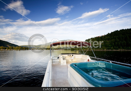 To use this stock image in your creative project, please select the size you need over to the right and click the "Add to Cart" button.
Your downloaded image will come with the Cutcaster watermark removed so don’t worry about the watermark you see on this page. Luxury Boat stock photo, A luxury house boat on a beautiful lake by Tyler Olson
