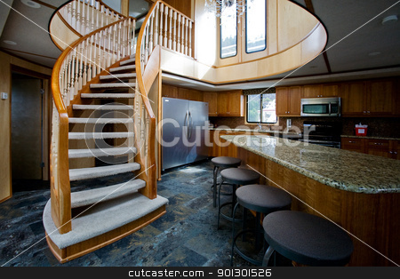 To use this stock image in your creative project, please select the size you need over to the right and click the "Add to Cart" button.
Your downloaded image will come with the Cutcaster watermark removed so don’t worry about the watermark you see on this page. Luxury yacht interior stock photo, A luxury yacht interior - kitchen and second floor by Tyler Olson
