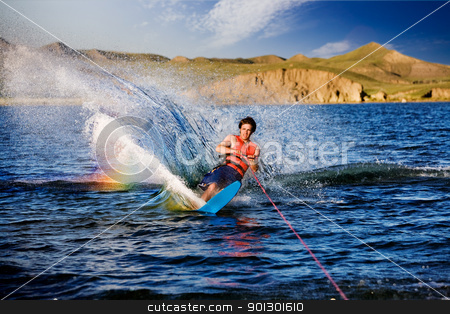 To use this stock image in your creative project, please select the size you need over to the right and click the "Add to Cart" button.
Your downloaded image will come with the Cutcaster watermark removed so don’t worry about the watermark you see on this page. Waterskiing stock photo, A male waterskiing on a beautiful lake by Tyler Olson