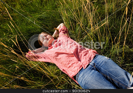 To use this stock image in your creative project, please select the size you need over to the right and click the "Add to Cart" button.
Your downloaded image will come with the Cutcaster watermark removed so don’t worry about the watermark you see on this page. Country Farm Girl stock photo, A country farm girl relaxing in the grass by Tyler Olson